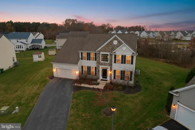 an aerial view of a house with a garden