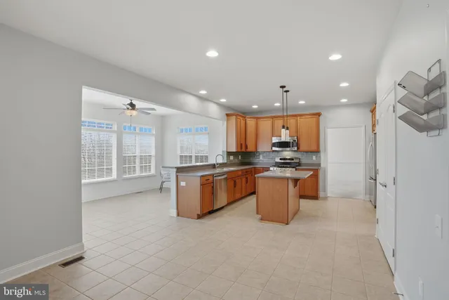 a kitchen with a refrigerator and a sink