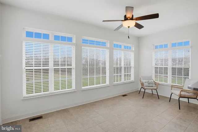 a living room with furniture and windows