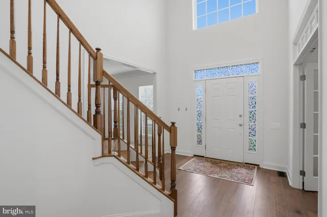 a view of an entryway with wooden floor