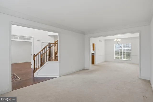 a view of an empty room with stairs
