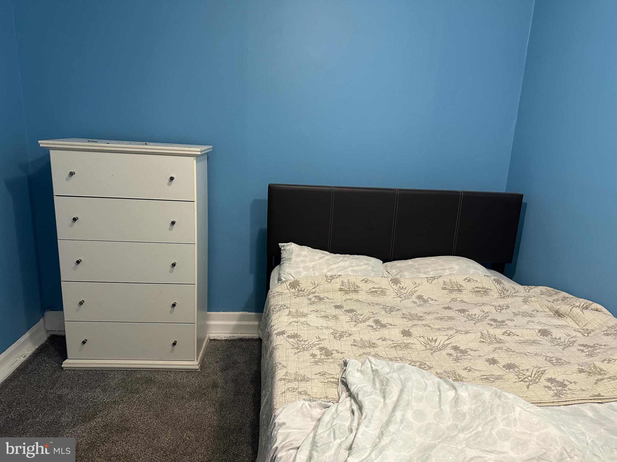 8411 11th Avenue Silver Spring, MD 20903 - Photo 22 of 24 a bedroom with a bed and a night stand