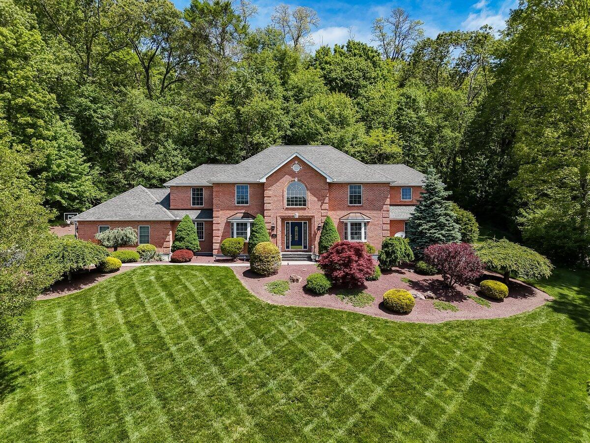 1376 Buck Ridge Drive Stroudsburg, PA 18360 - Photo 1 of 56 a front view of house with yard outdoor seating and green space