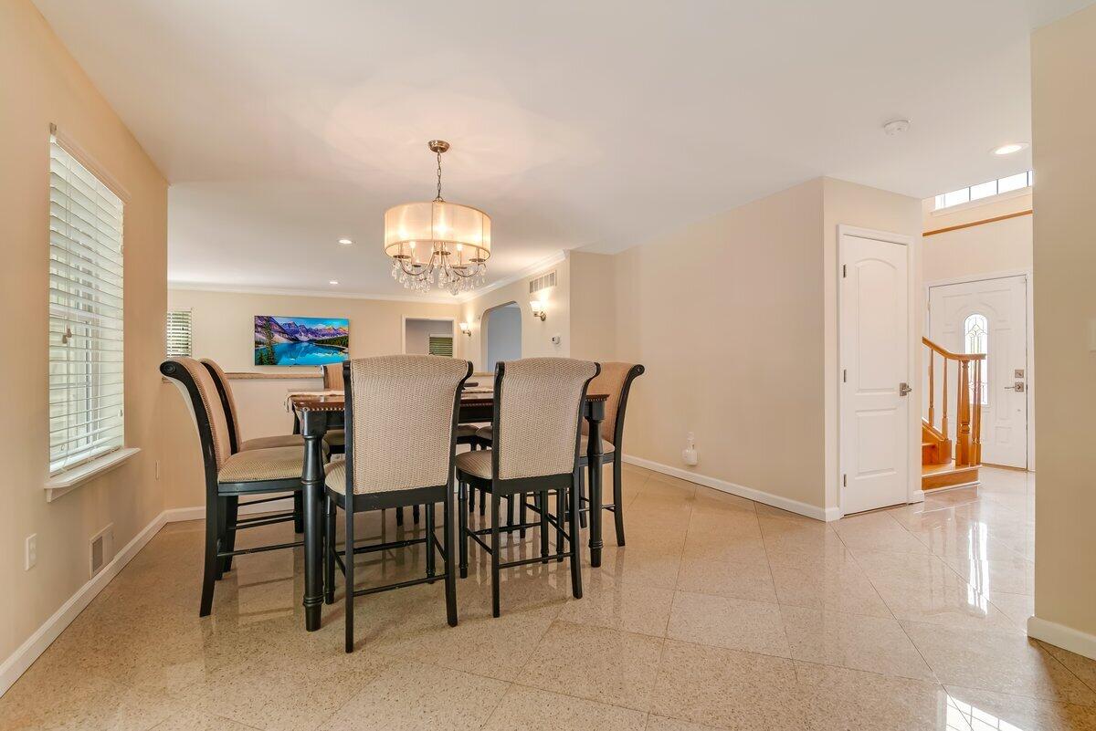 1376 Buck Ridge Drive Stroudsburg, PA 18360 - Photo 13 of 56 a view of a dining room with furniture and chandelier