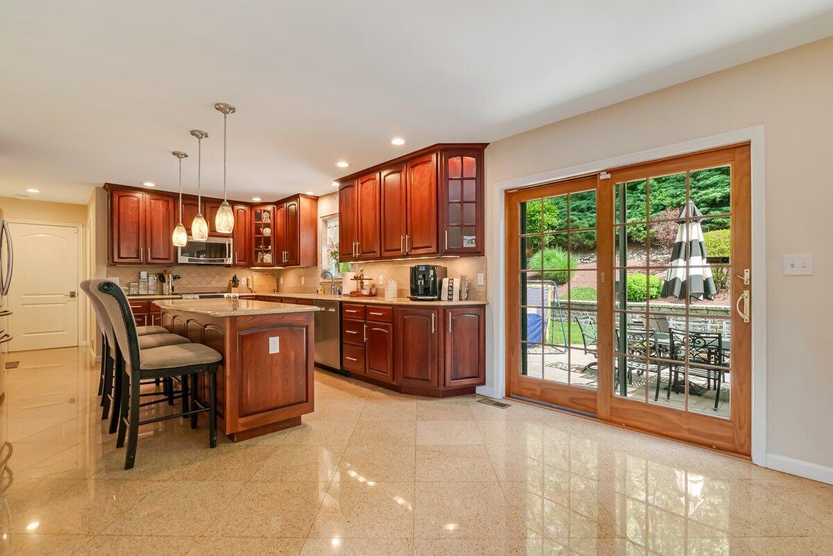 1376 Buck Ridge Drive Stroudsburg, PA 18360 - Photo 14 of 56 a kitchen with a sink a counter top space and appliances