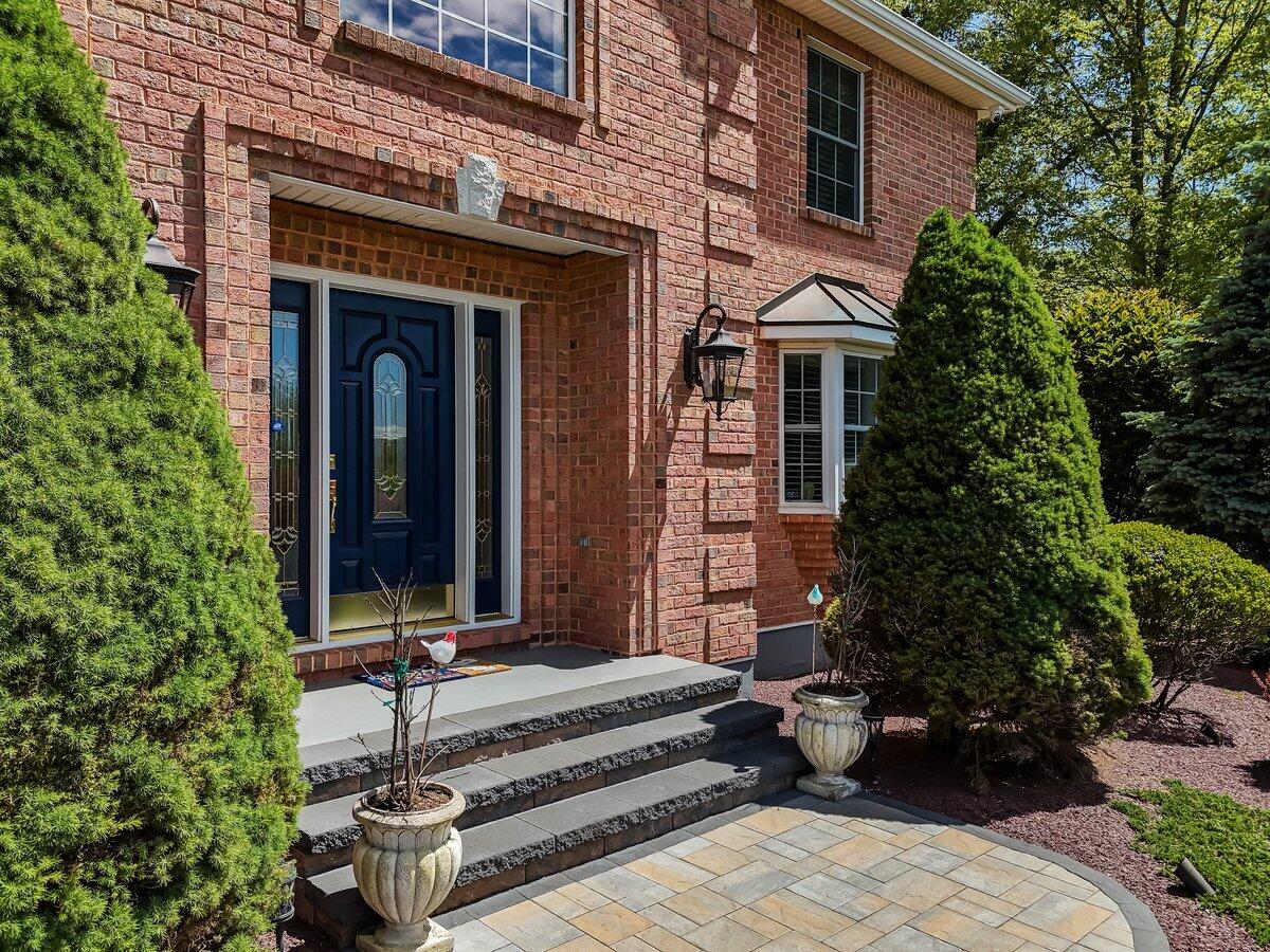 1376 Buck Ridge Drive Stroudsburg, PA 18360 - Photo 3 of 56 a front view of a house with a garden