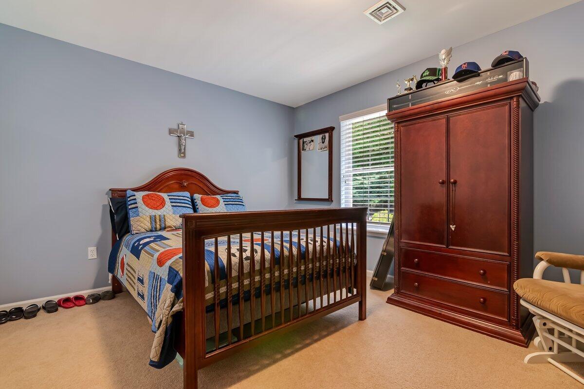 1376 Buck Ridge Drive Stroudsburg, PA 18360 - Photo 33 of 56 a bedroom with a bed and a baby crib