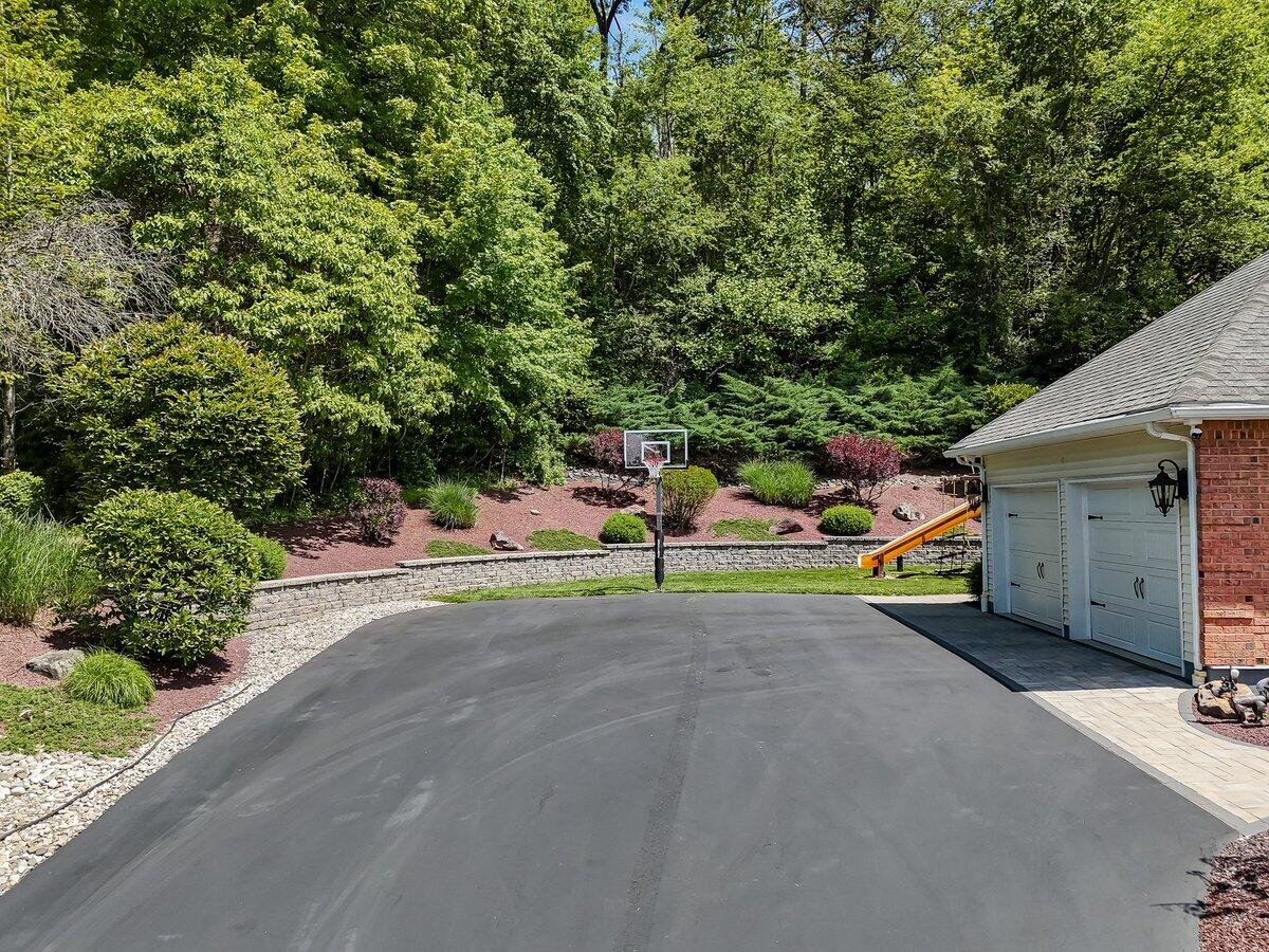 1376 Buck Ridge Drive Stroudsburg, PA 18360 - Photo 43 of 56 a view of a park with plants and a bench