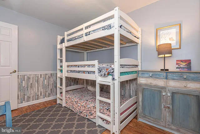 a kitchen with stainless steel appliances kitchen island granite countertop a sink and a stove