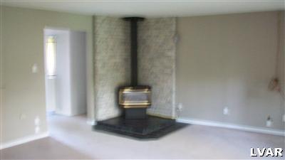 3654 Winchester Road Allentown, PA 18104 - Photo 10 of 18 This gas fireplace in l/r could be replaced with a conventional fireplace using the existing flue and chimney, and possible addition of a hearth and mantle.