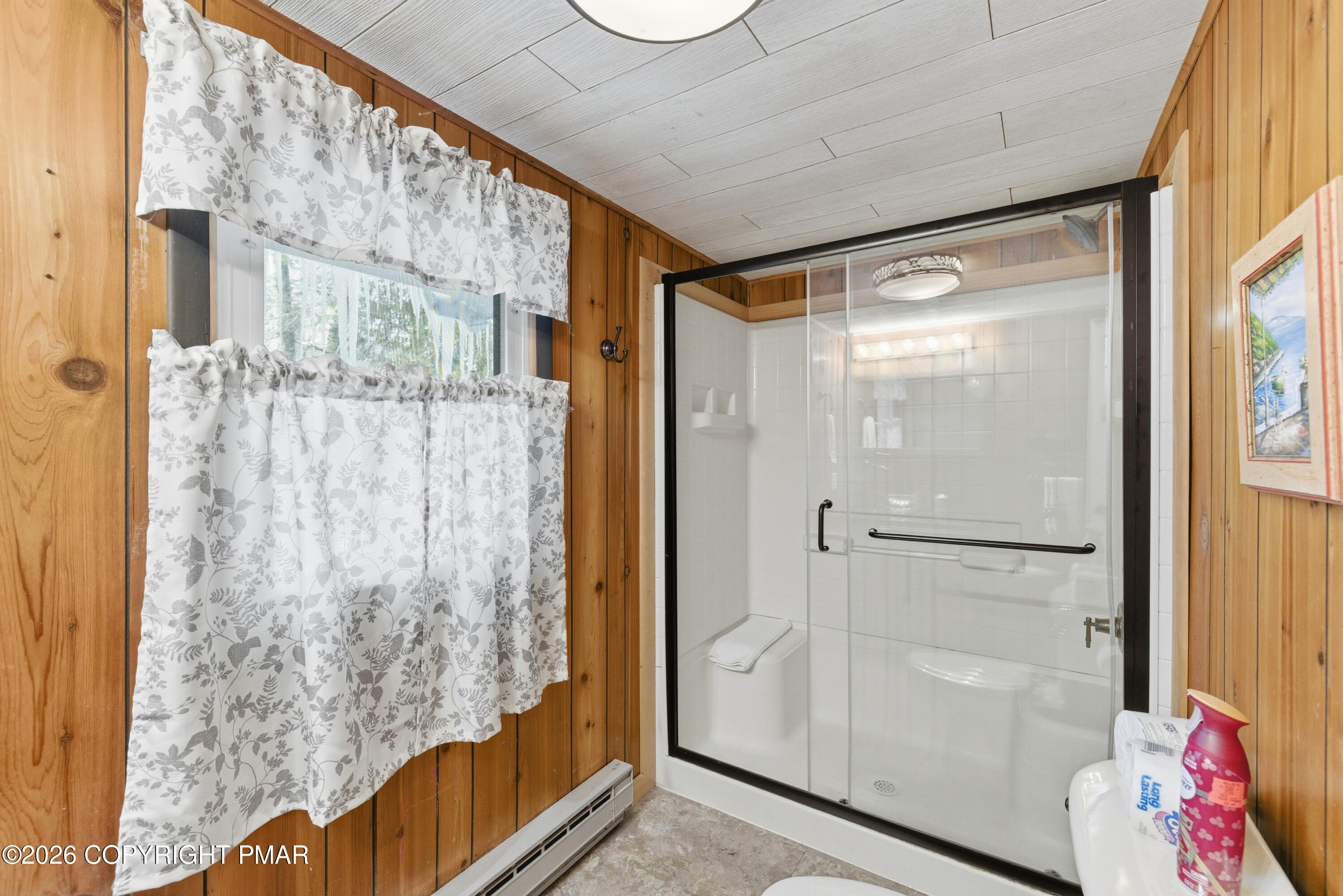 119 Long Woods Road Tobyhanna, PA 18466 - Photo 12 of 27 a bathroom with a glass shower door and a window
