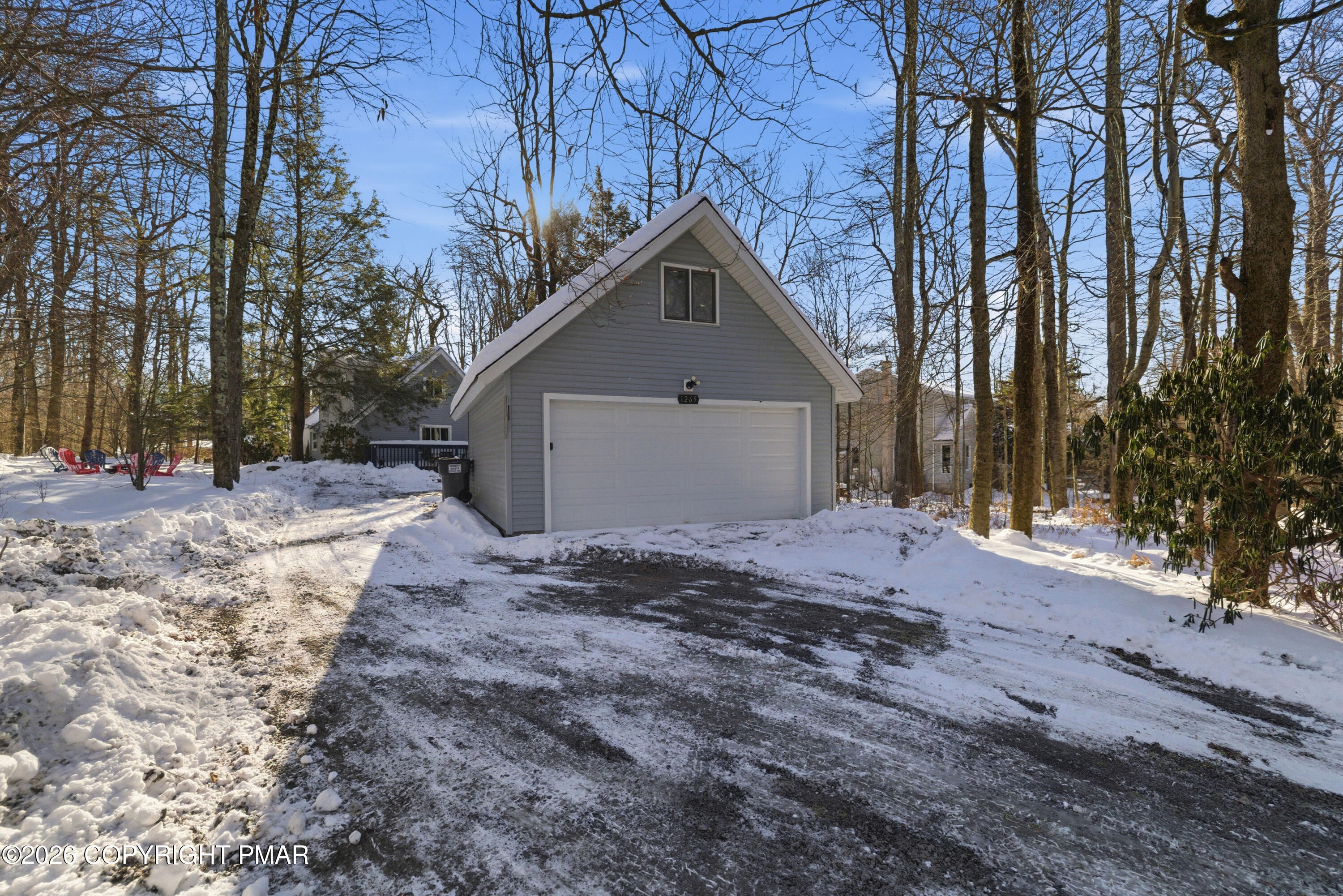 119 Long Woods Road Tobyhanna, PA 18466 - Photo 2 of 27 a view of a house with a yard covered in snow