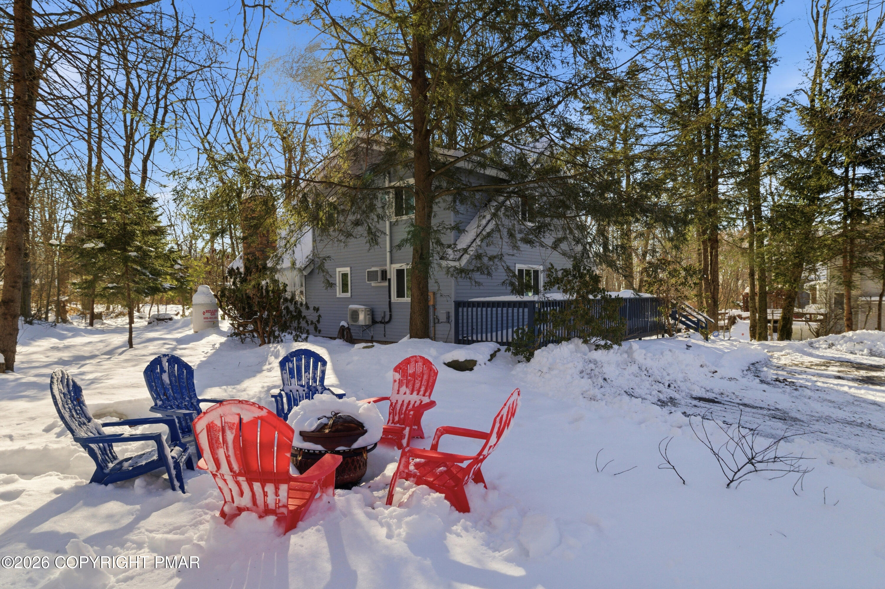 119 Long Woods Road Tobyhanna, PA 18466 - Photo 3 of 27 a view of backyard with outdoor seating and trees