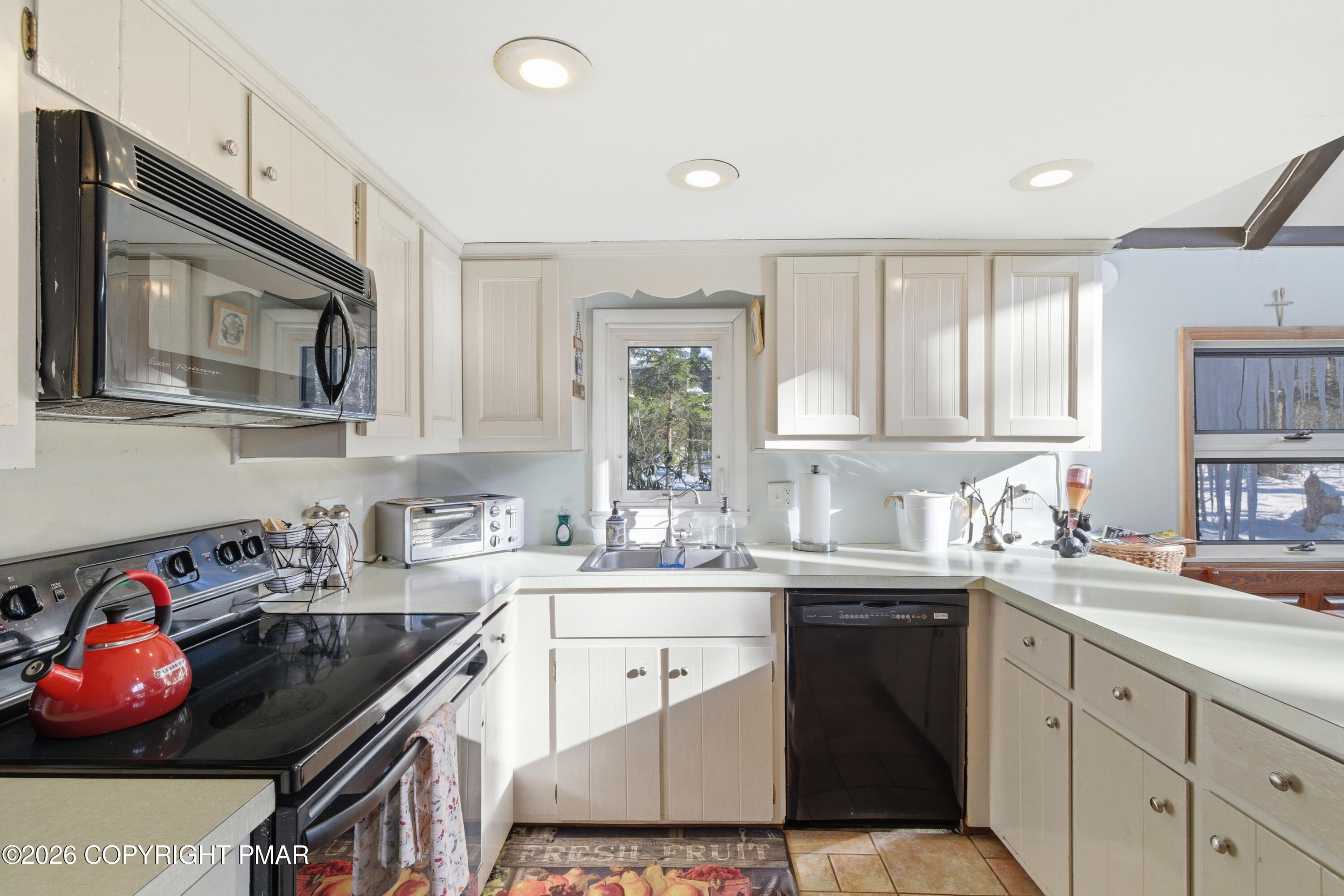 119 Long Woods Road Tobyhanna, PA 18466 - Photo 9 of 27 a kitchen with stainless steel appliances a sink stove top oven and cabinets