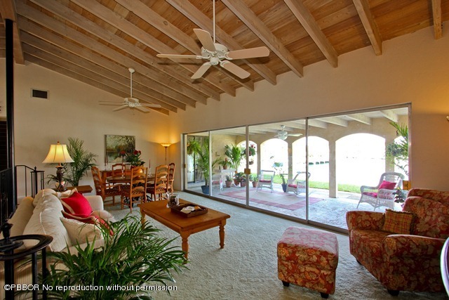 1180 Singer Drive Riviera Beach, FL 33404 - Photo 3 of 16 a living room with furniture and a floor to ceiling window