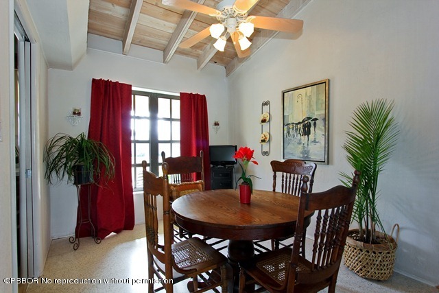 1180 Singer Drive Riviera Beach, FL 33404 - Photo 6 of 16 a view of a dining room with furniture and window