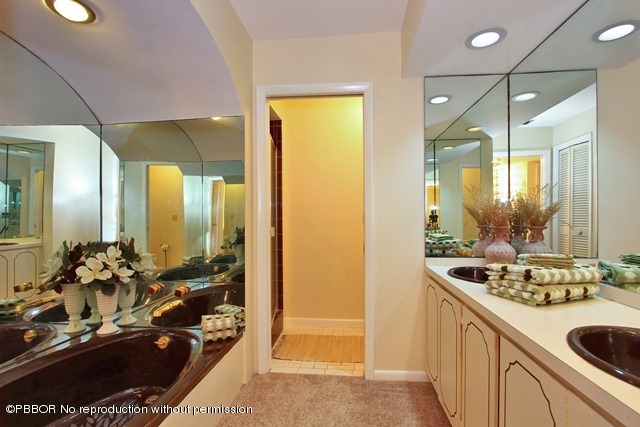 1180 Singer Drive Riviera Beach, FL 33404 - Photo 9 of 16 a bathroom with a sink and a mirror