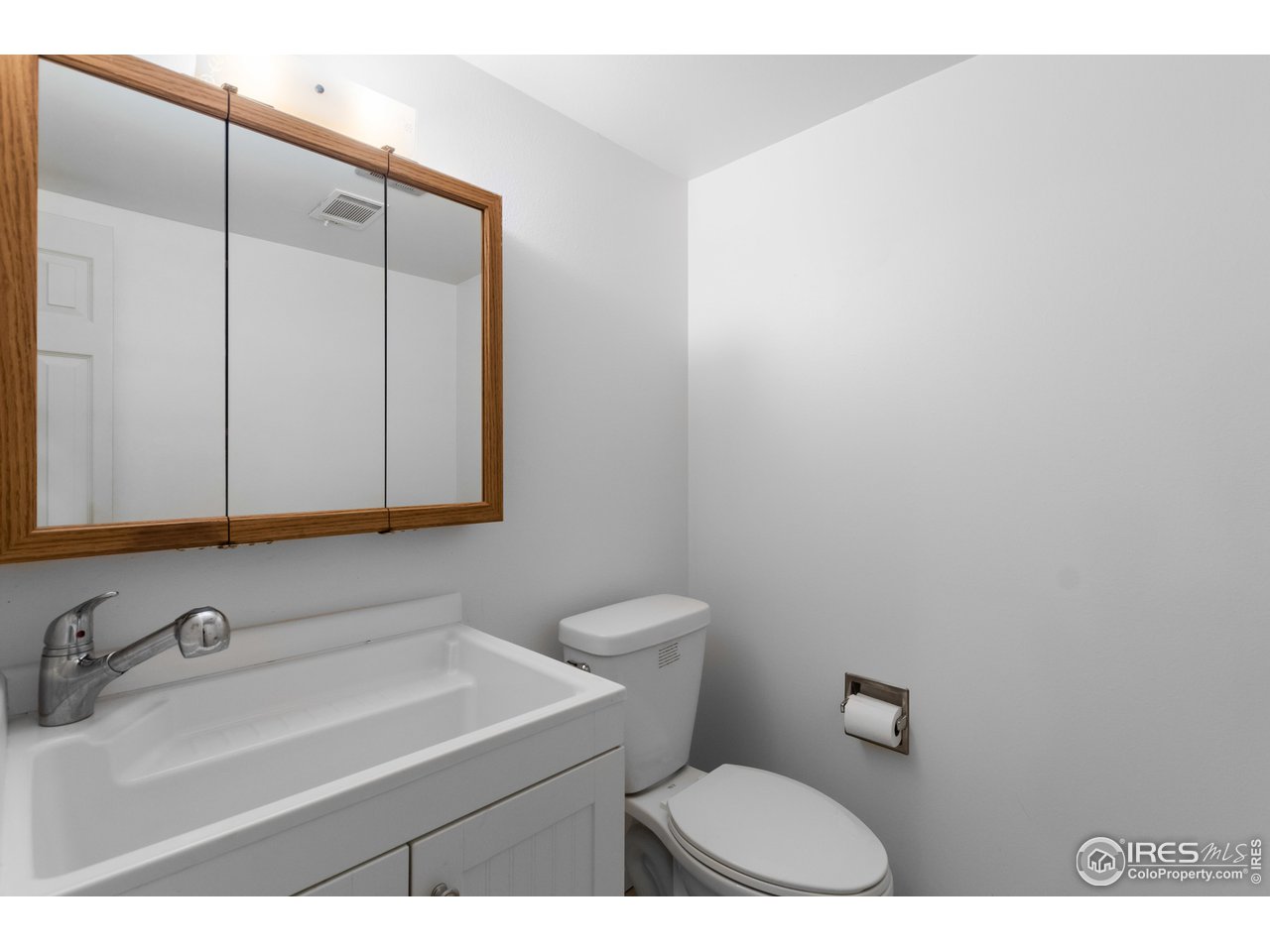 737 Kimball Road Fort Collins, CO 80521 - Photo 21 of 36 1/2 bath with utility sink next to laundry