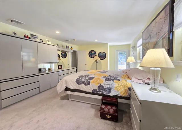 a bed room with a bed and a lamp