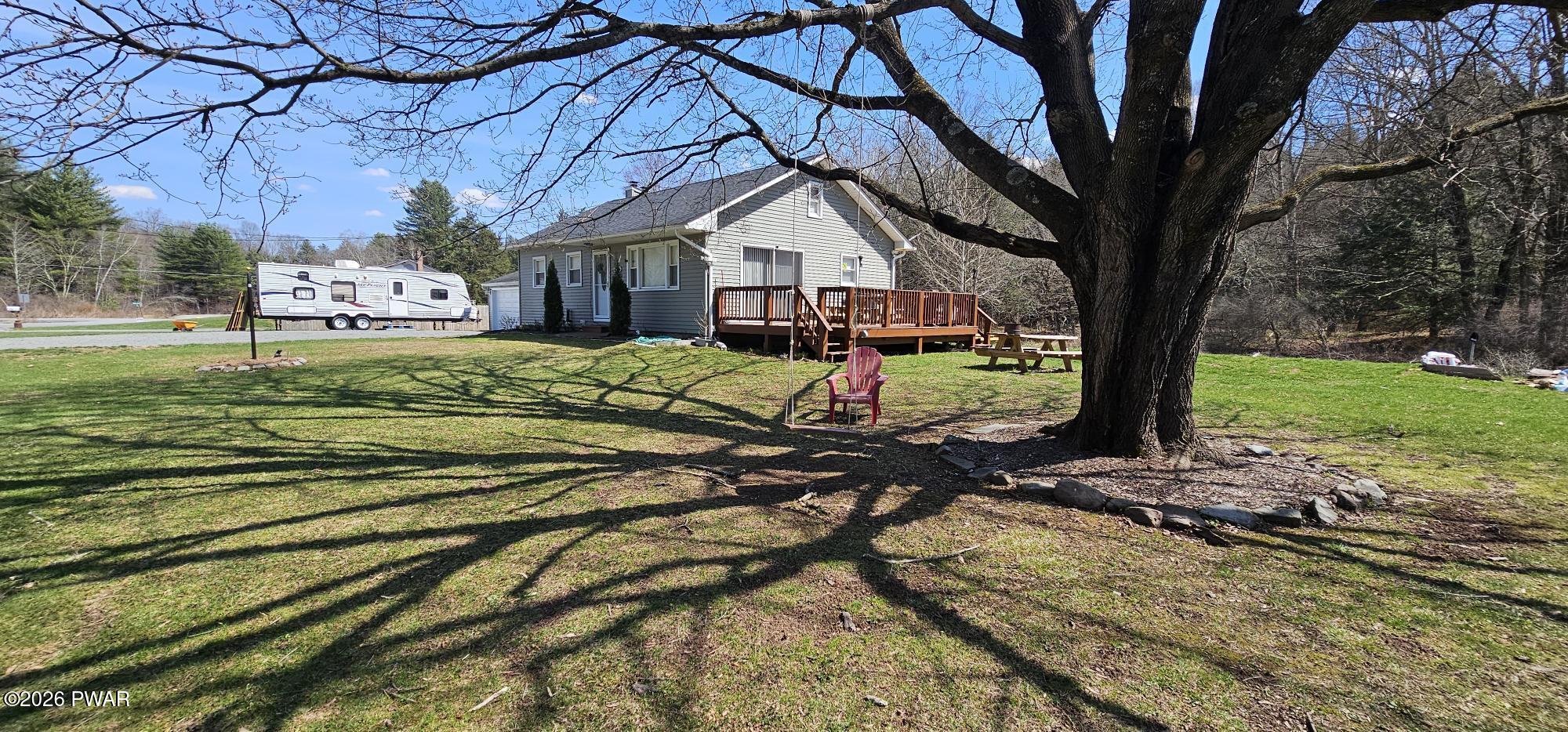 430 Griffith Road Tyler Hill, PA 18469 - Photo 2 of 31 a small garden in the middle of a house