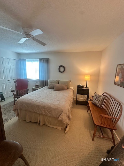 25 Farmington Chase Crescent, Unit 25 Farmington, CT 06032 - Photo 11 of 18 a spacious bedroom with a bed and chair