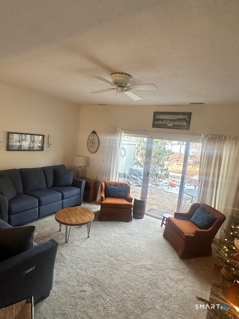 25 Farmington Chase Crescent, Unit 25 Farmington, CT 06032 - Photo 3 of 18 a living room with furniture and a large window
