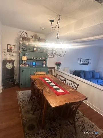 a kitchen with stainless steel appliances kitchen island granite countertop a stove a sink and a microwave