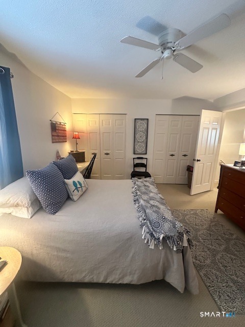 25 Farmington Chase Crescent, Unit 25 Farmington, CT 06032 - Photo 8 of 18 a bedroom with a bed and wooden floor