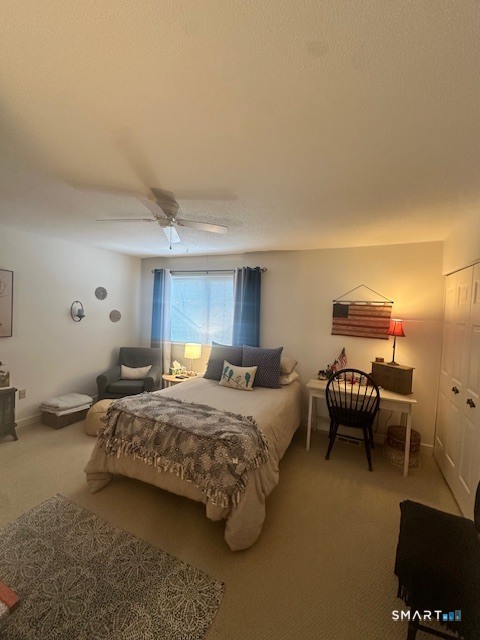 25 Farmington Chase Crescent, Unit 25 Farmington, CT 06032 - Photo 10 of 18 a bedroom with a bed and a couch