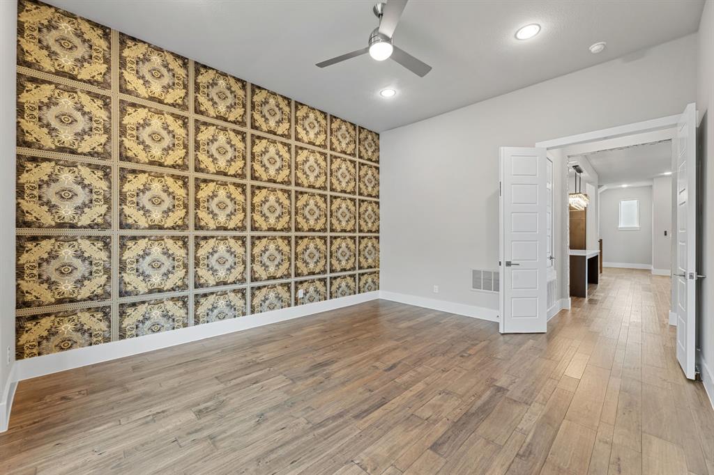 7854 Element Avenue Plano, TX 75024 - Photo 26 of 38 Unfurnished room featuring light wood finished floors, recessed lighting, an accent wall, and a ceiling fan