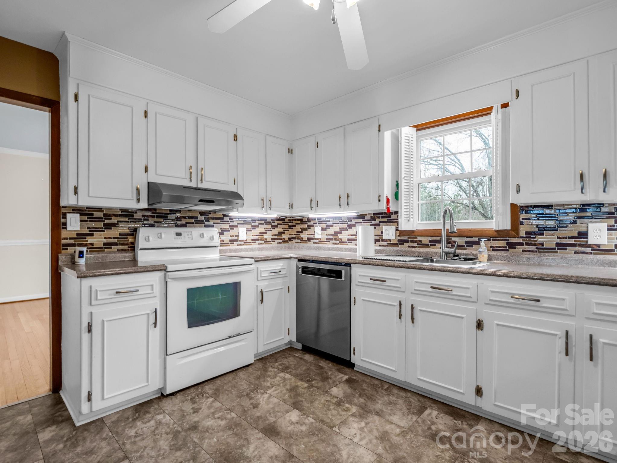 315 Walker Store Road Ellenboro, NC 28040 - Photo 11 of 39 a kitchen with appliances a sink and cabinets