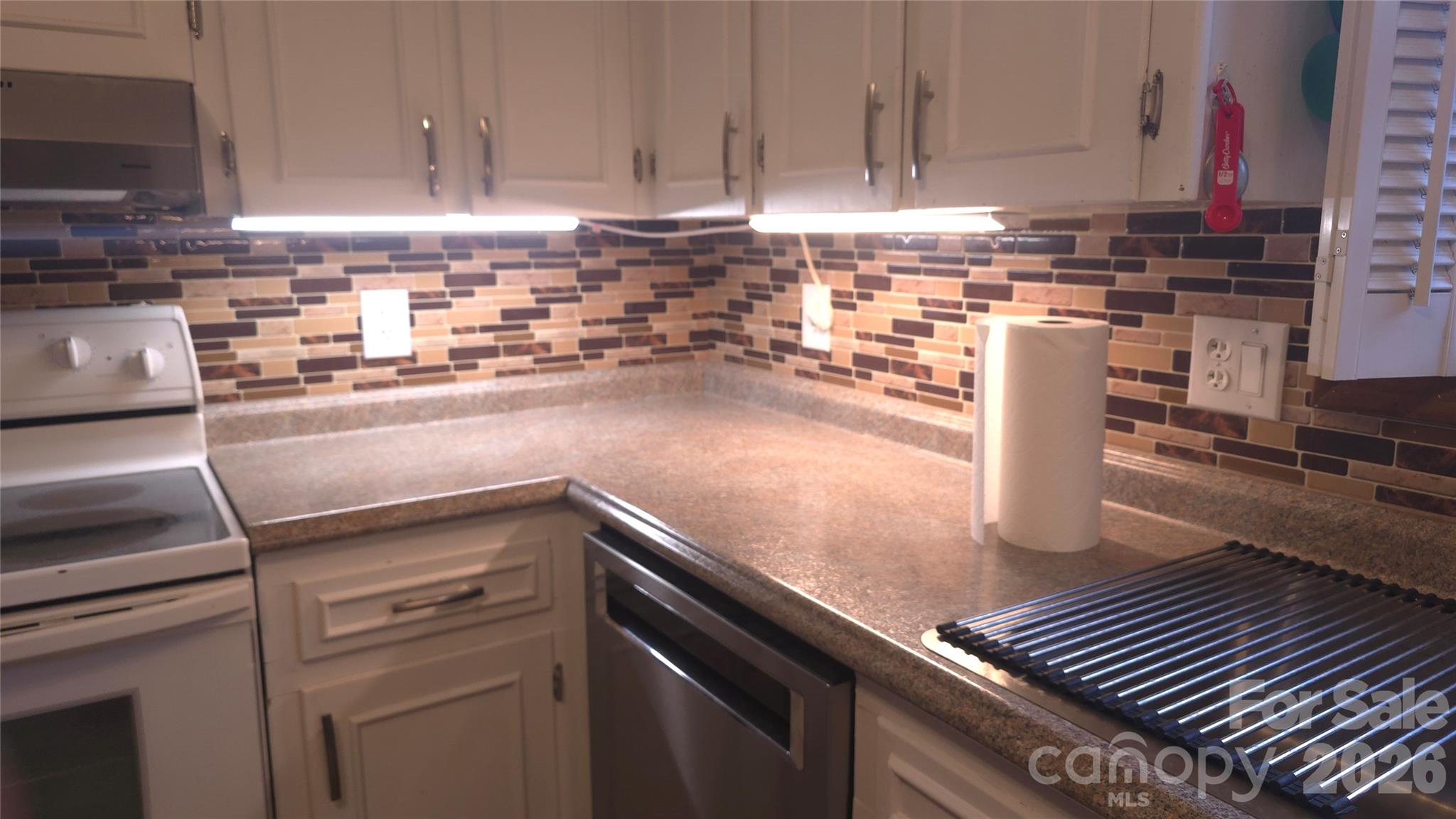 315 Walker Store Road Ellenboro, NC 28040 - Photo 12 of 39 a kitchen with stainless steel appliances granite countertop a sink a stove and cabinets