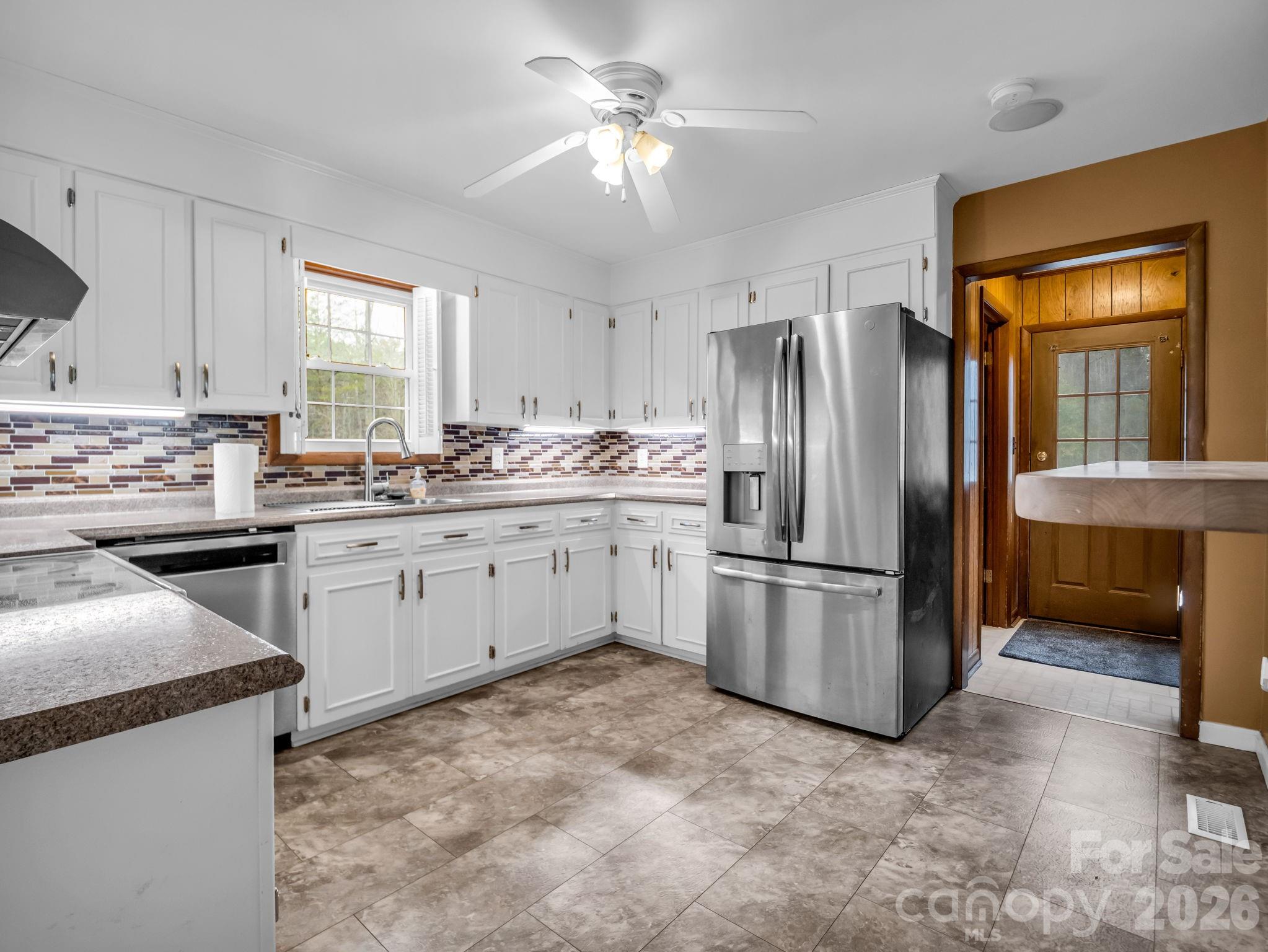 315 Walker Store Road Ellenboro, NC 28040 - Photo 13 of 39 a kitchen with stainless steel appliances a refrigerator sink and cabinets