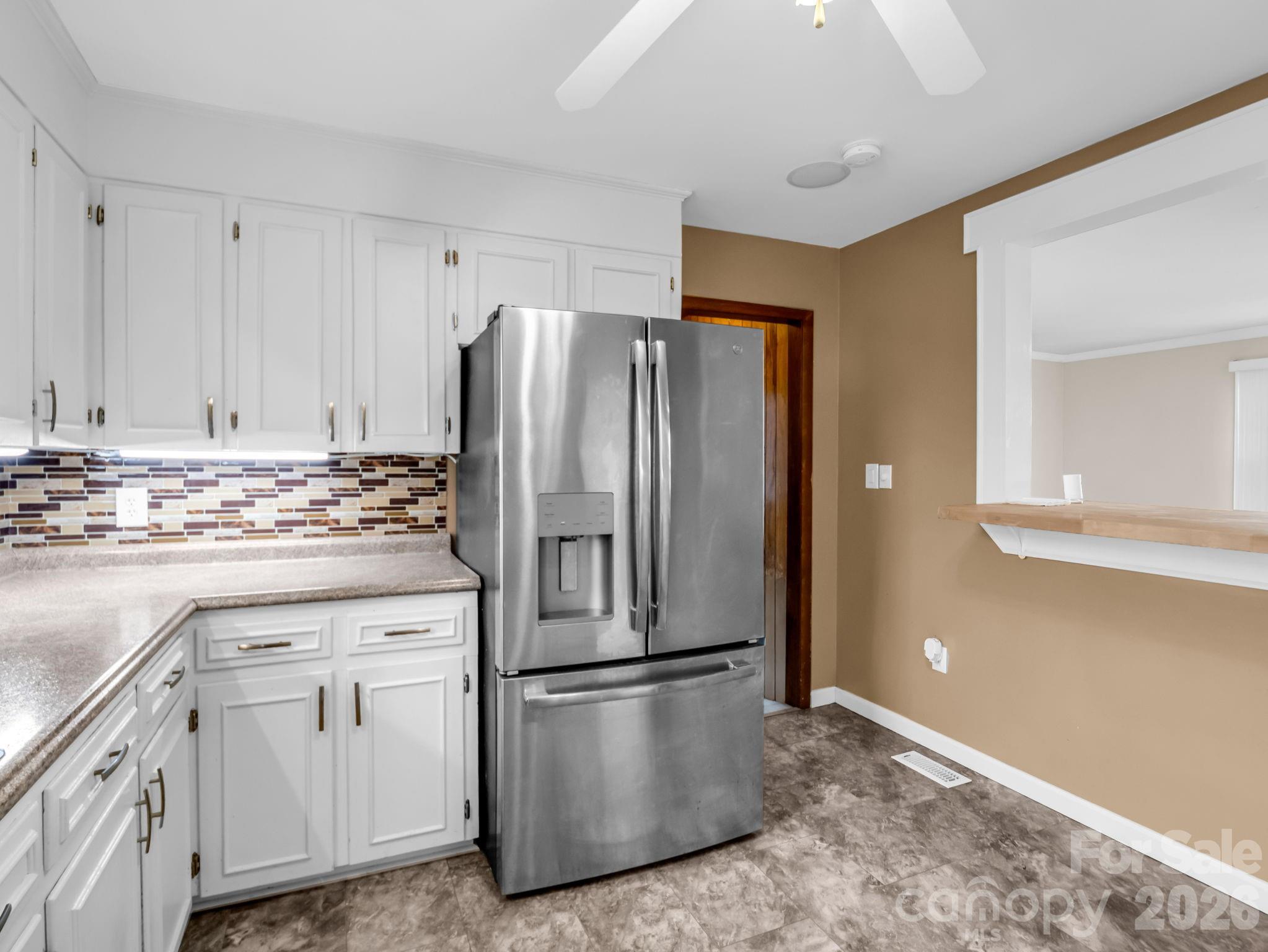 315 Walker Store Road Ellenboro, NC 28040 - Photo 14 of 39 a kitchen with stainless steel appliances a refrigerator sink and cabinets