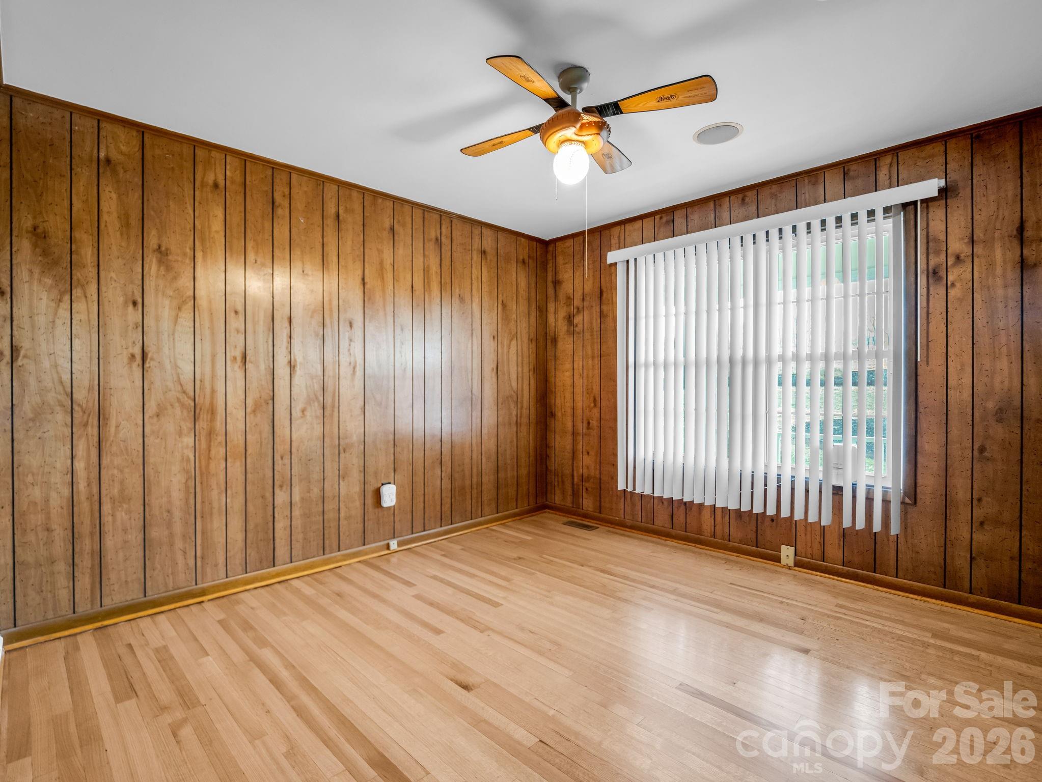 315 Walker Store Road Ellenboro, NC 28040 - Photo 17 of 39 wooden floor in an empty room with a window