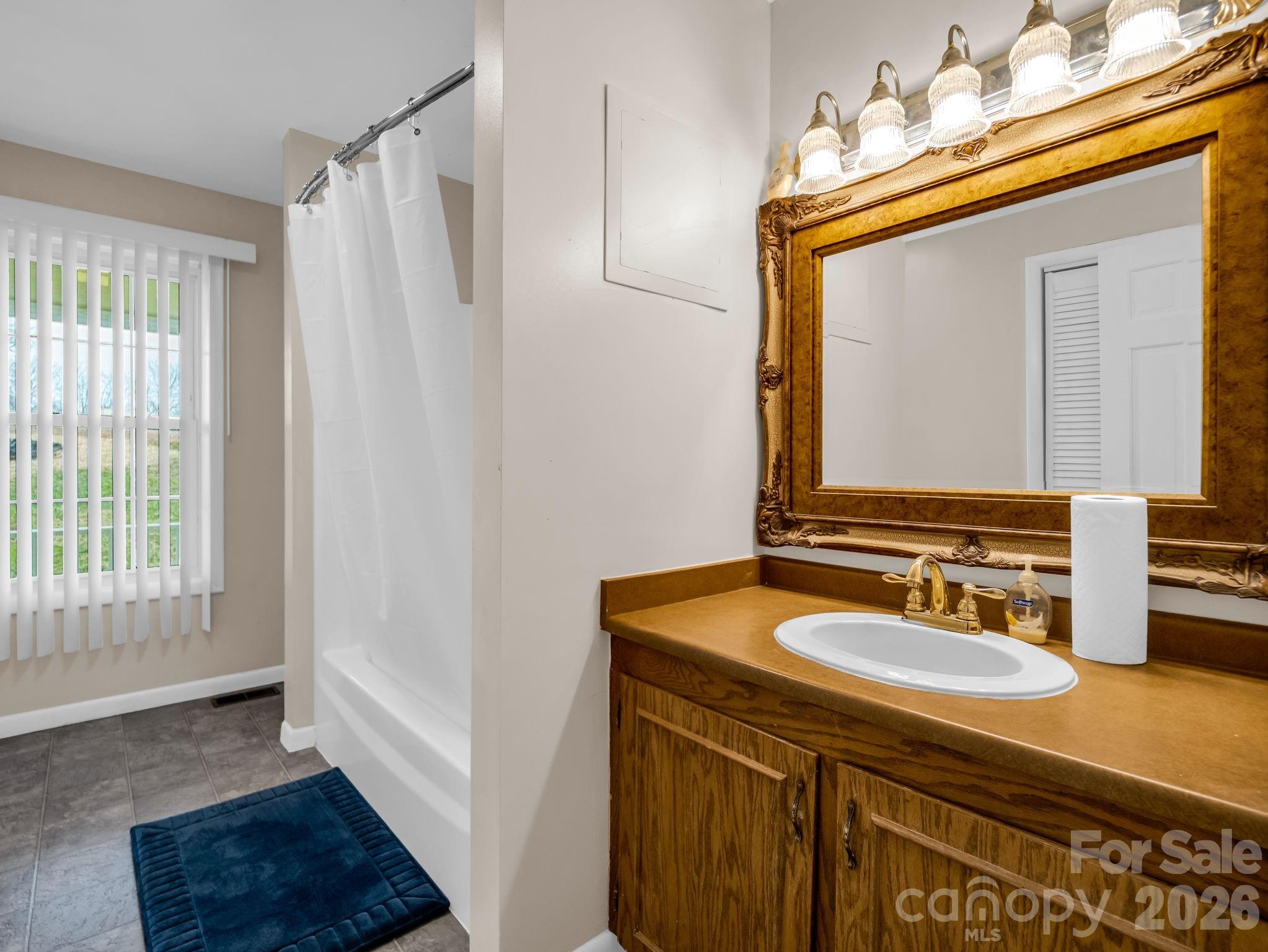 315 Walker Store Road Ellenboro, NC 28040 - Photo 18 of 39 a bathroom with a sink vanity granite and a mirror
