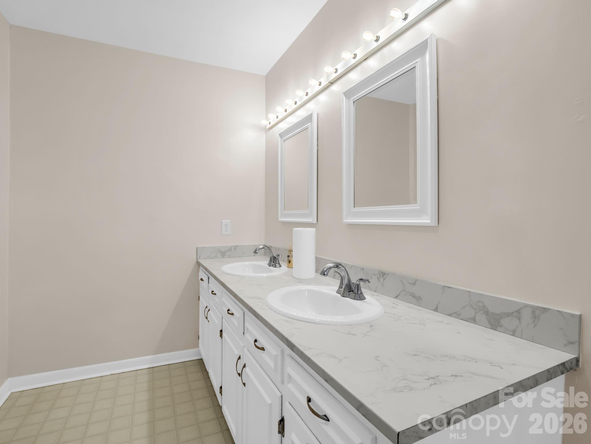 315 Walker Store Road Ellenboro, NC 28040 - Photo 22 of 39 a bathroom with a sink double vanity and a mirror