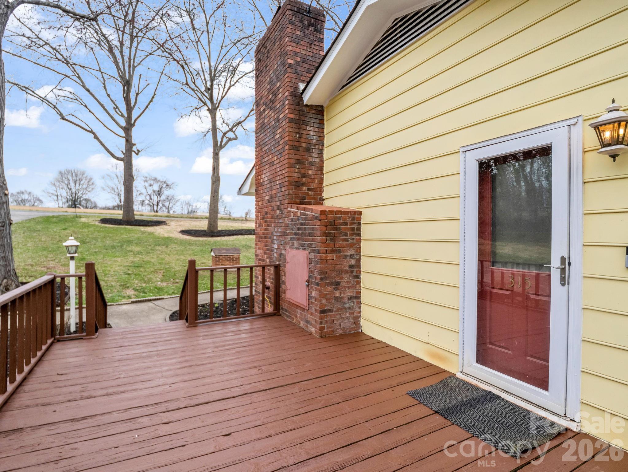 315 Walker Store Road Ellenboro, NC 28040 - Photo 29 of 39 a view of a deck with chairs and wooden floor