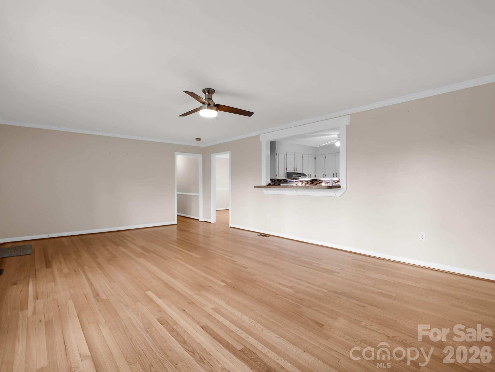 315 Walker Store Road Ellenboro, NC 28040 - Photo 9 of 39 a view of empty room with wooden floor and ceiling fan