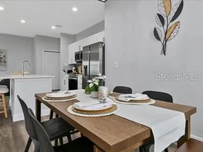 a dining room with furniture and window