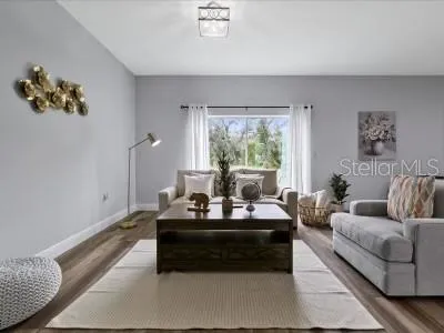 a living room with furniture and a large window