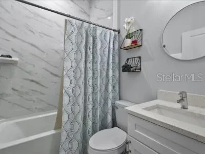 a bathroom with a sink a toilet and a bathtub