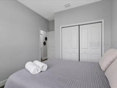 a view of a livingroom with a baby crib