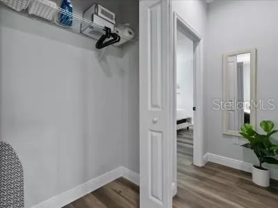 a view of a room with wooden floor