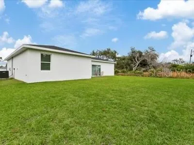 a bathroom with a sink and a yard