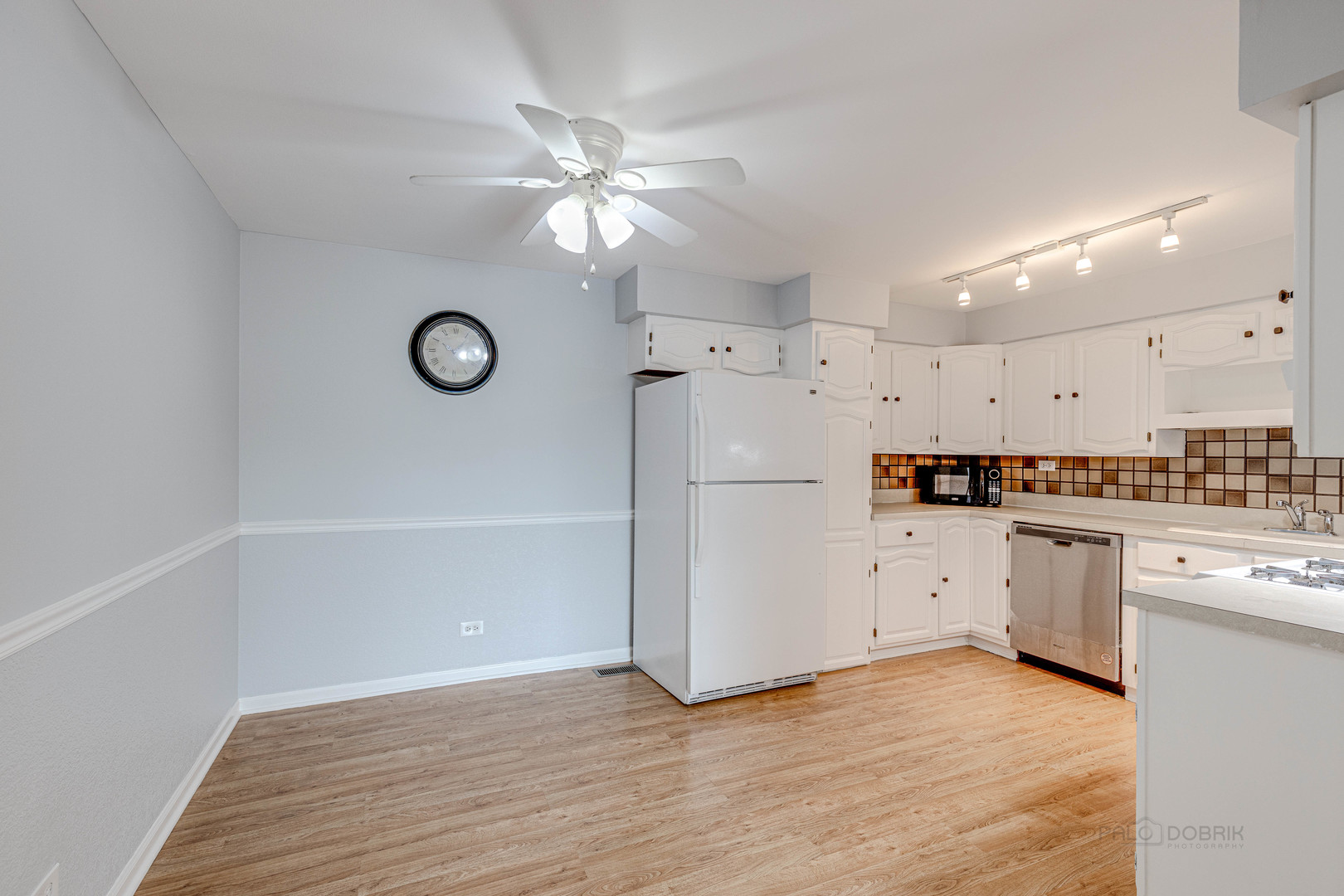 1100 Stoughton Court, Unit 1711 Schaumburg, IL 60193 - Photo 11 of 25 a kitchen with cabinets stainless steel appliances and a window