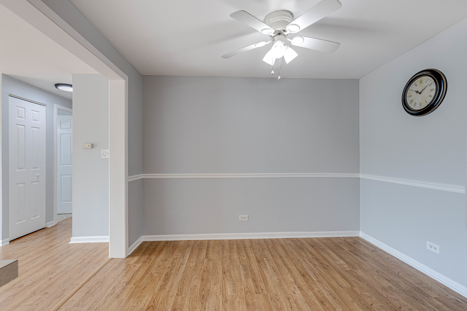 1100 Stoughton Court, Unit 1711 Schaumburg, IL 60193 - Photo 16 of 25 an empty room with wooden floor and a ceiling fan