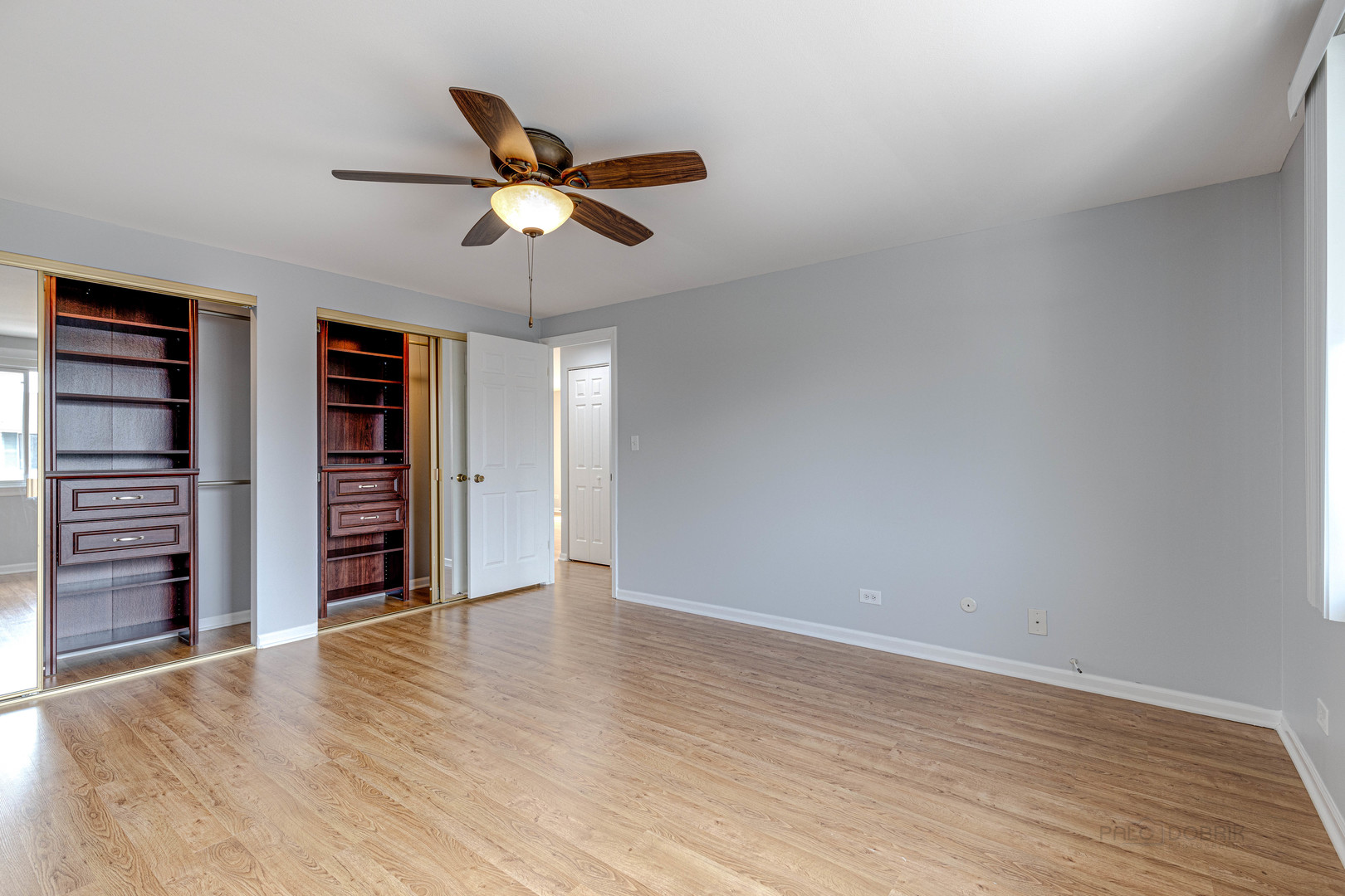 1100 Stoughton Court, Unit 1711 Schaumburg, IL 60193 - Photo 18 of 25 wooden floor in an empty room with a window