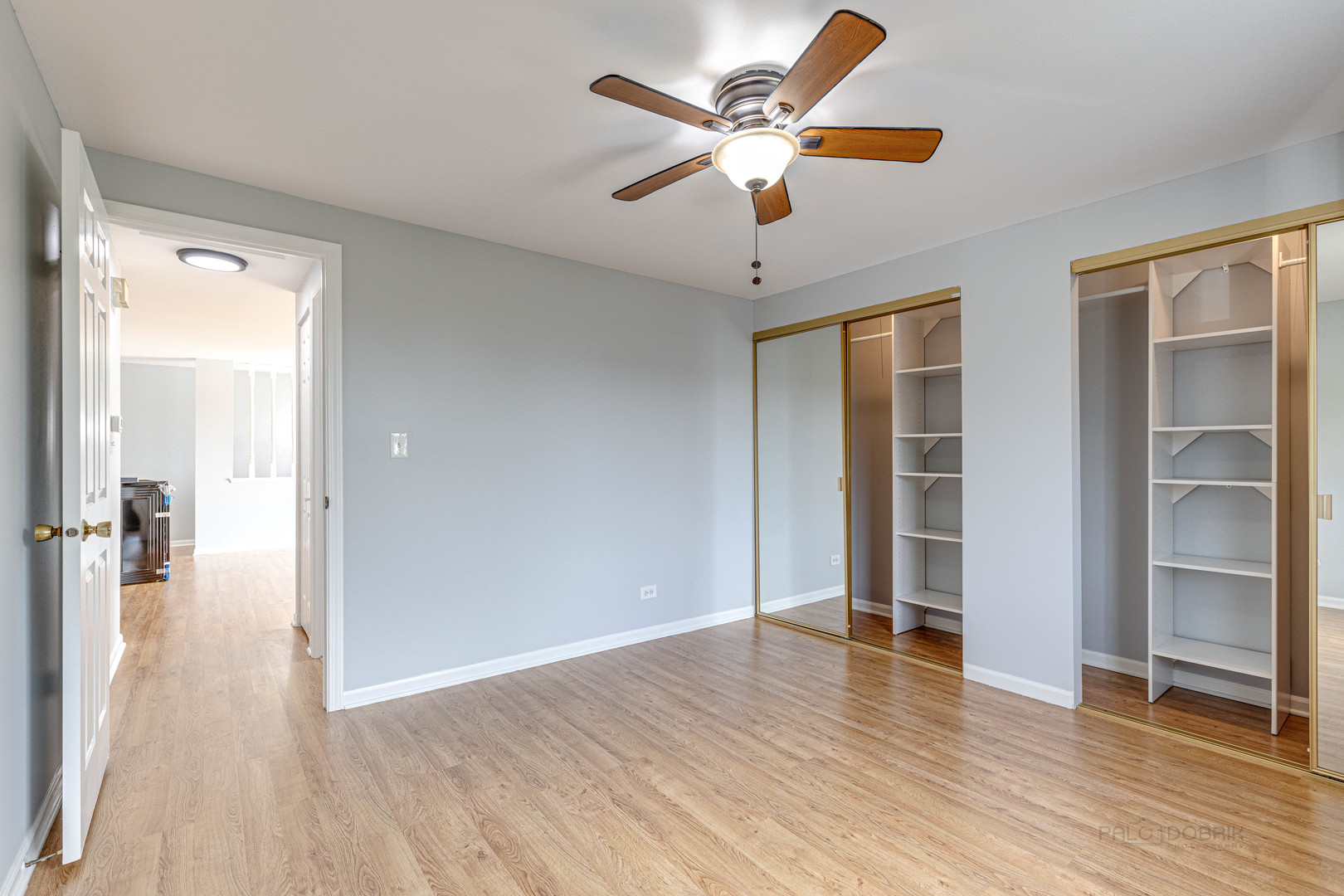 1100 Stoughton Court, Unit 1711 Schaumburg, IL 60193 - Photo 20 of 25 wooden floor in an empty room with a window