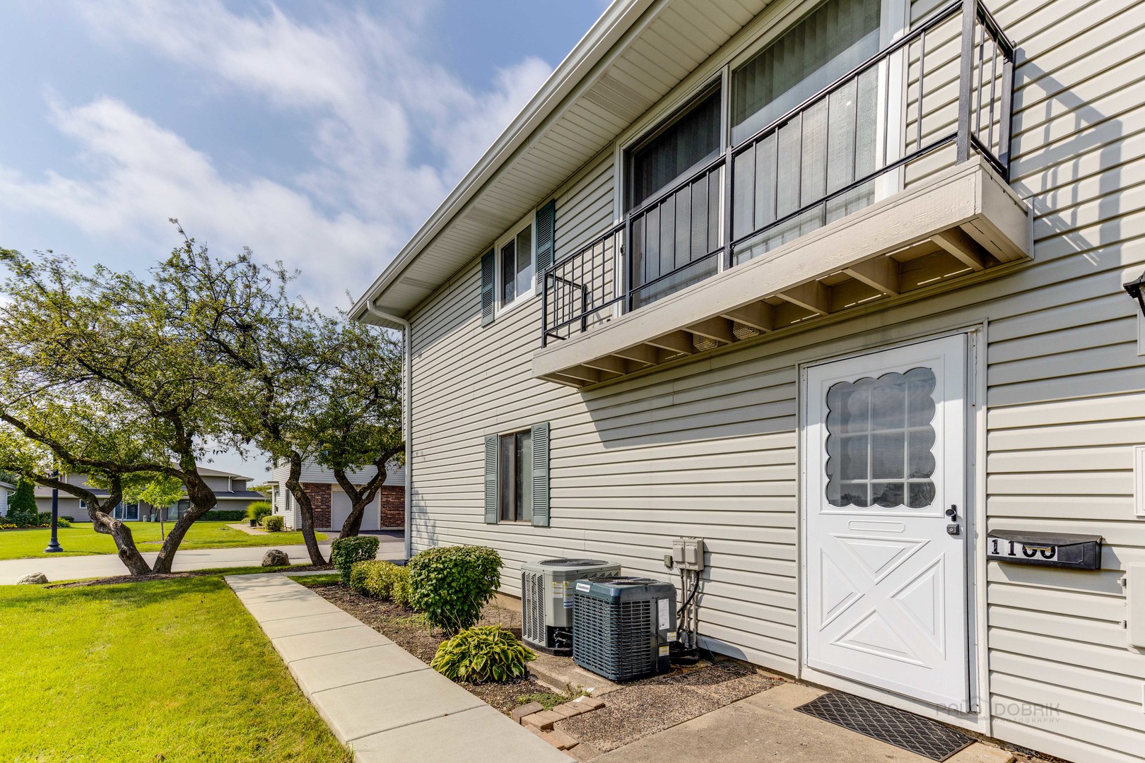 1100 Stoughton Court, Unit 1711 Schaumburg, IL 60193 - Photo 2 of 25 a view of a house with a swimming pool